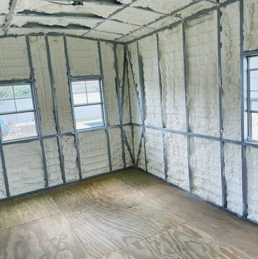 Closed-cell spray foam insulation applied to wall cavities in a residential project in Monroe